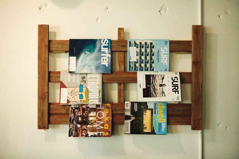 Do or Dye HTX salon magazine rack and wall decor